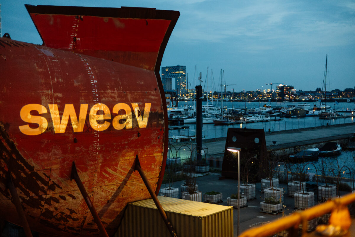 Sweav logo projected at the Sweav Private Equity Dinner.