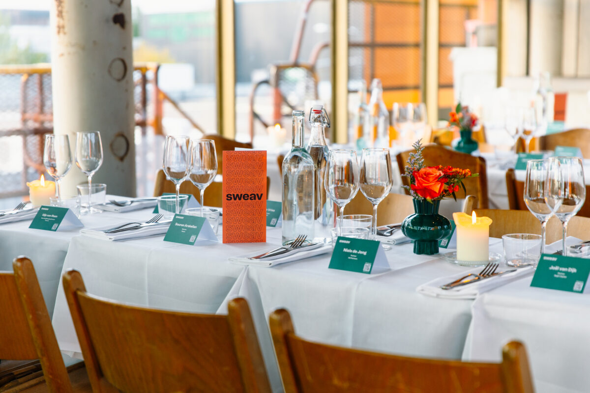 Dinner tables with Sweav branding event in Amsterdam.